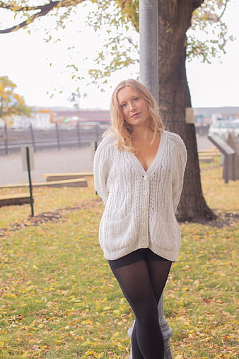 Blonde Woman in White Cardigan Standing in Autumn Park