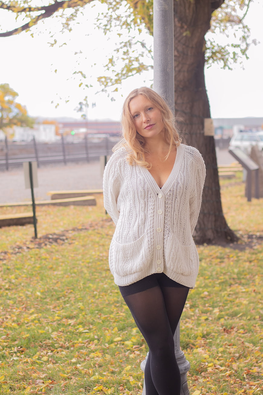 Blonde Woman in White Cardigan Standing in Autumn Park