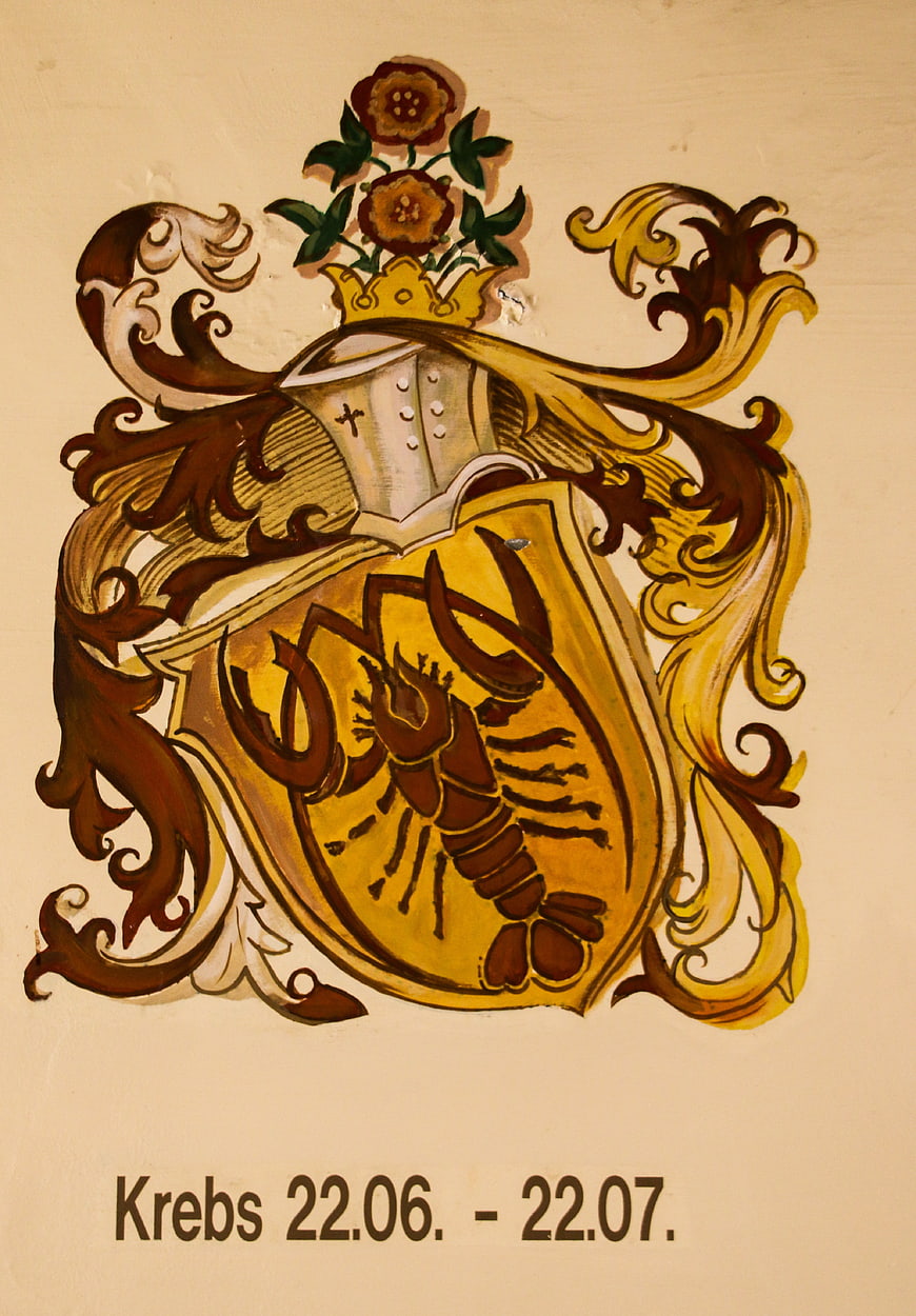 Hand-painted Cancer zodiac sign crest with crab symbol and German text
