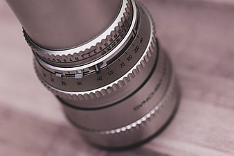 Close-up of vintage camera lens with focus rings