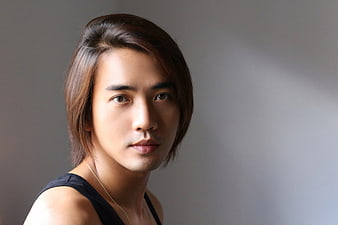 Portrait of Asian Man with Long Hair and Gold Necklace