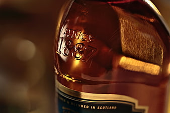 Close-up of Amber Whisky Bottle with Embossed Date