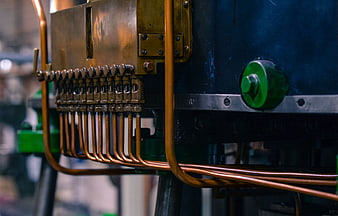 Close-up of copper pipes and industrial machinery components