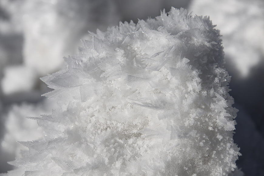Macro Close-Up of Intricate White Ice Crystals and Frost Texture