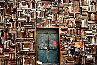 Vintage Books Wall with Green Door Background