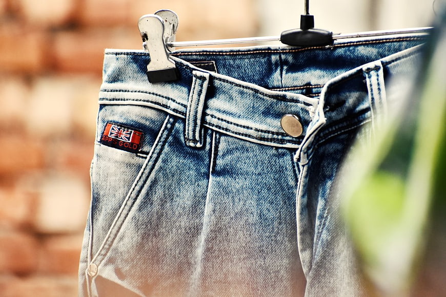 Close-up of Washed Blue Jeans on Hanger