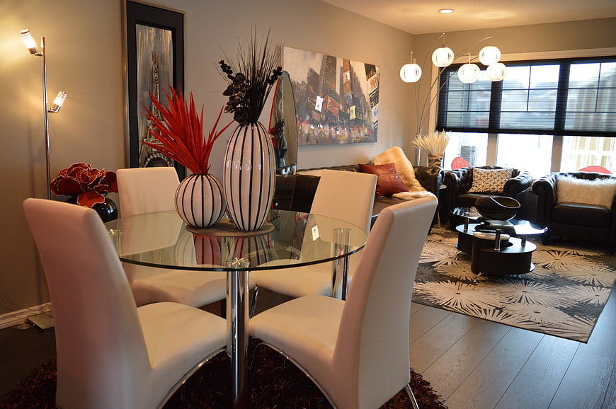Modern dining and living room interior with glass table