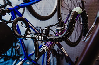 Close-up of wet road bike handlebars in a shop