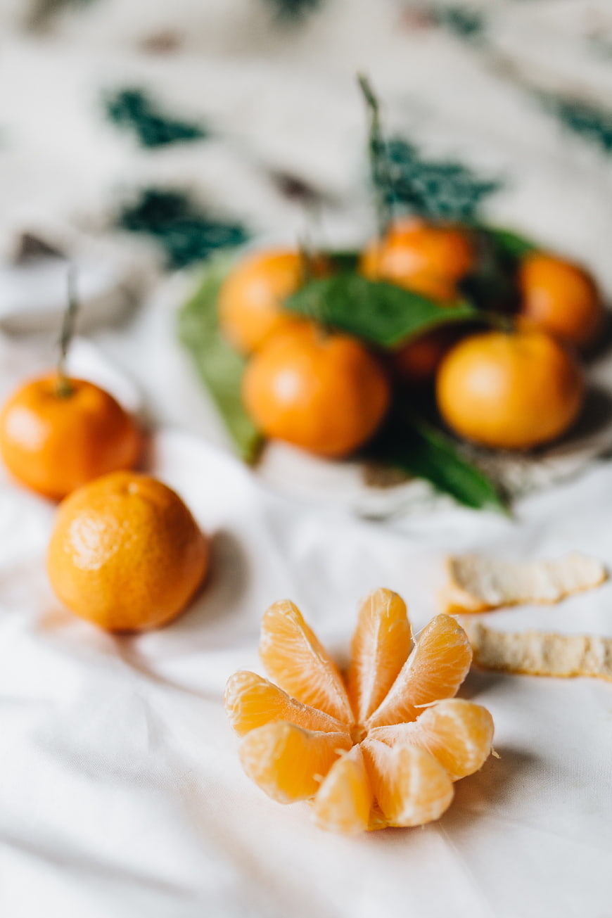 Fresh Tangerines and Segments on White Linen