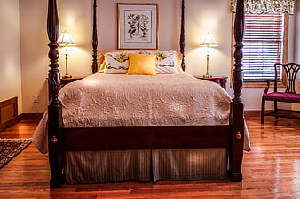 Traditional Four-Poster Bedroom with Hardwood Floors