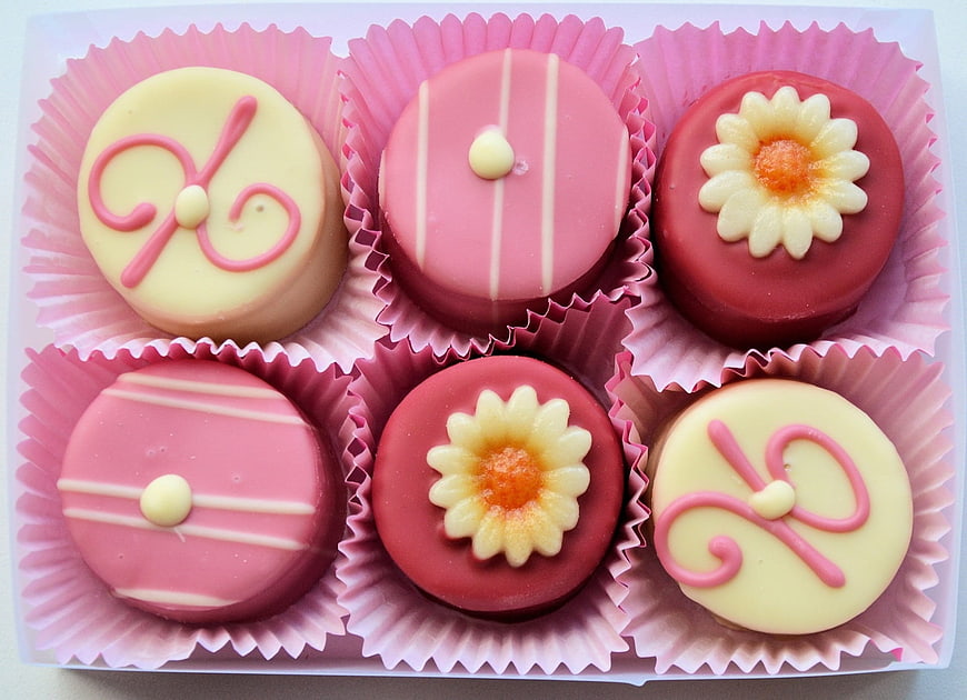 Box of six pink and white decorated chocolate truffles