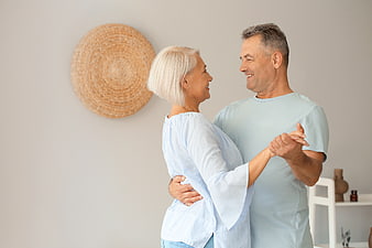Happy Senior Couple Dancing Together at Home