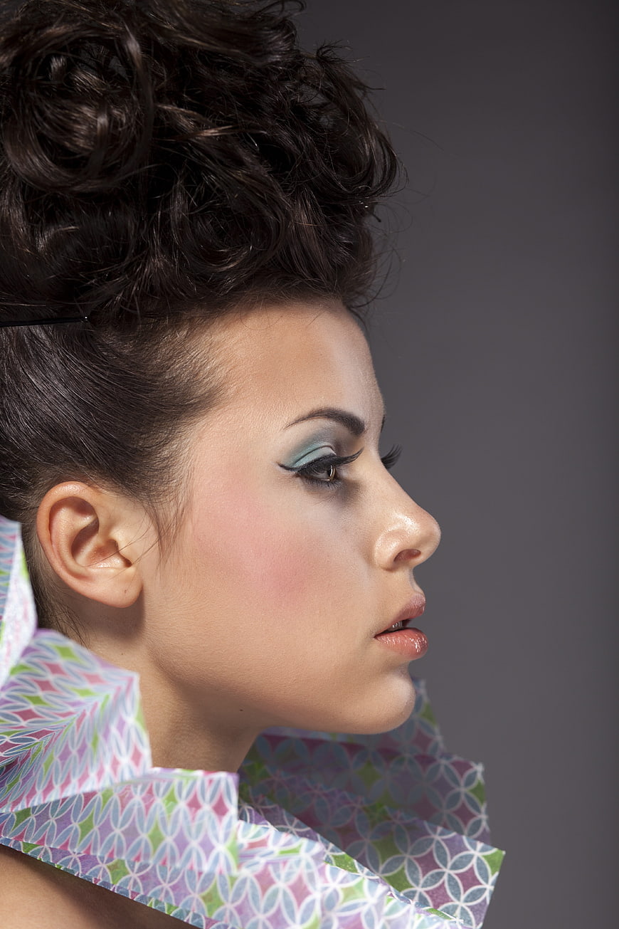 Profile Portrait of Woman with Creative Makeup and Patterned Collar