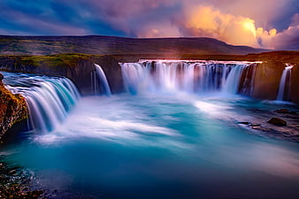 Godafoss Waterfall in Iceland at Sunset with Blue Water