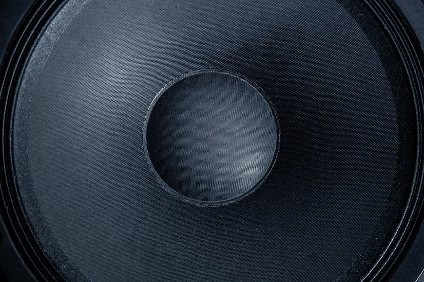 Close-up of black speaker cone texture and surround