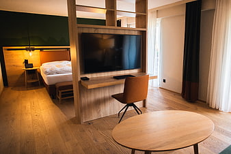 Modern Hotel Room Interior with Wooden Furniture and TV