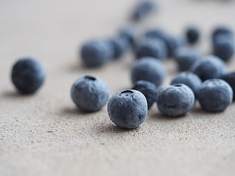 Fresh Blueberries on Textured Surface Close-Up