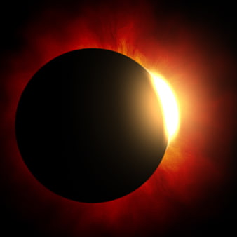 Dramatic Solar Eclipse with Fiery Red Corona