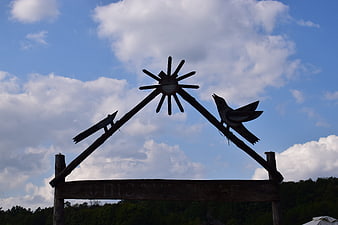 Wooden Folk Sign with Birds and Sun Silhouette