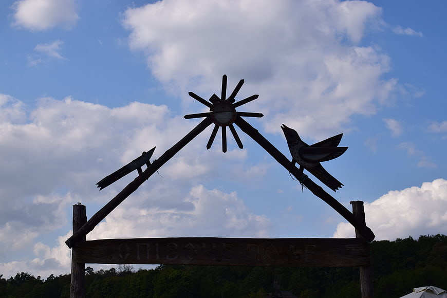 Wooden Folk Sign with Birds and Sun Silhouette