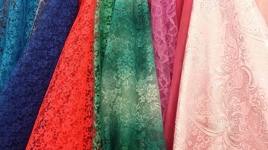 Colorful Lace and Embroidered Fabric Textures Close Up