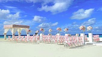Beach Wedding Ceremony Setup With Floral Arch In Maldives