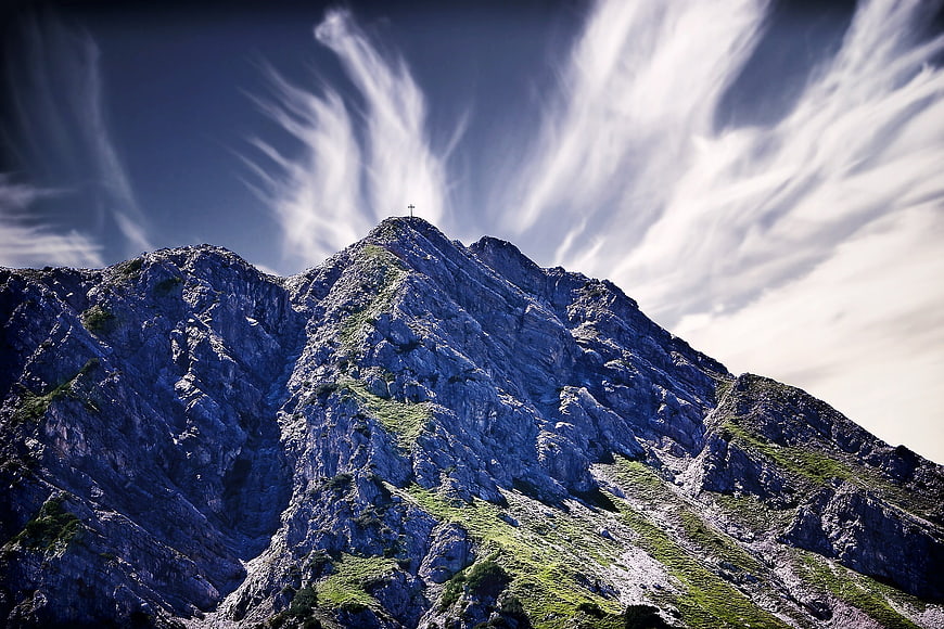 Dramatic Mountain Peak with Streaking Cirrus Clouds