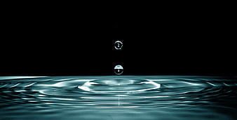 Water Droplet Splash Ripples On Black Background