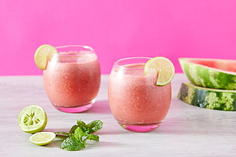 Refreshing Watermelon Smoothie with Lime and Mint on Pink Background