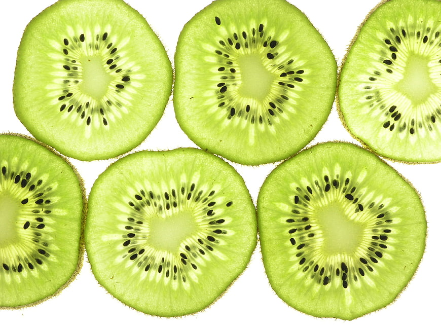 Sliced Kiwi Fruit Pattern On White Background