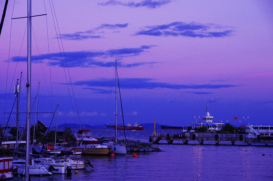 Sailboats in Harbor at Twilight with Purple Sky