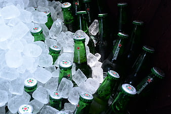 Chilled Heineken beer bottles in ice bucket