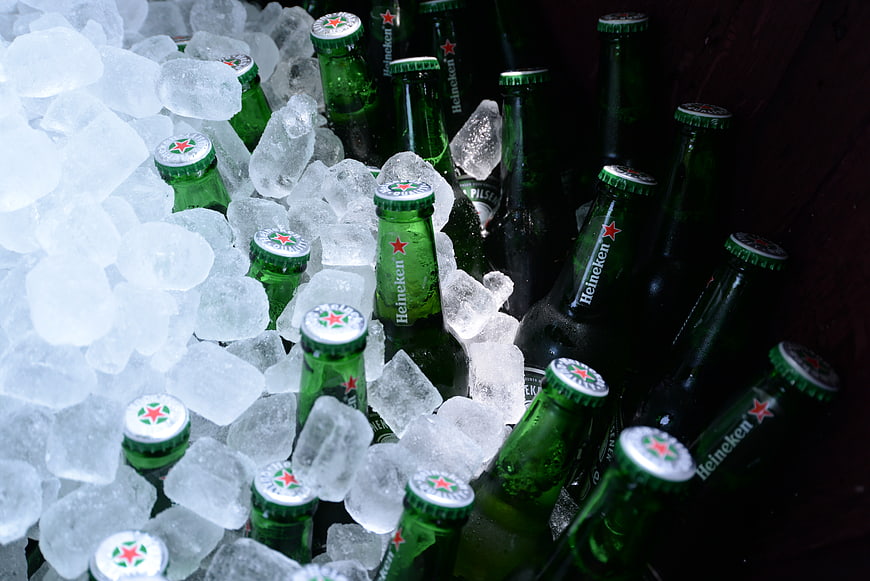 Chilled Heineken beer bottles in ice bucket