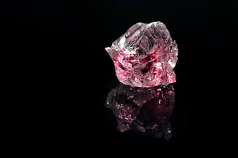 Raw Pink Crystal Gemstone on Black Background
