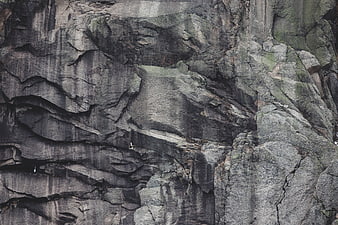 Rugged Rock Cliff Face Texture with Weathered Stone Layers