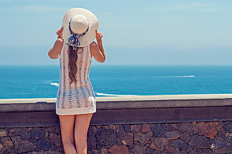 Woman in Straw Hat Looking at Ocean View