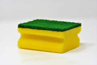 Yellow and Green Cleaning Sponge on White Background