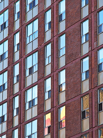 Red Brick Apartment Building Facade with Window Pattern