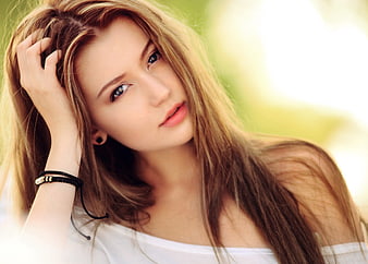 Young Woman Portrait With Long Blonde Hair And Blue Eyes