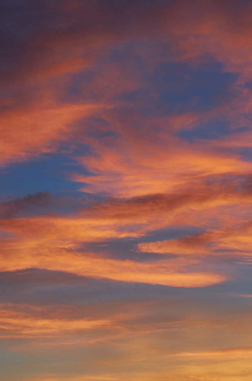 Vibrant Pink and Orange Sunset Sky with Clouds