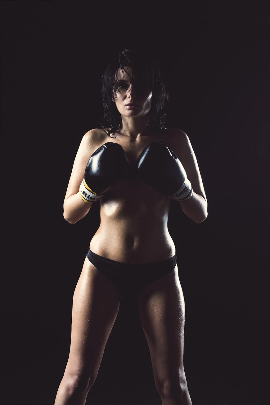 Athletic Woman in Boxing Gloves and Black Bikini Bottoms