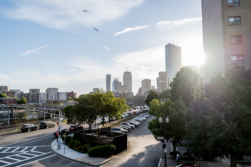 Boston Skyline with Sun Flare and City Traffic