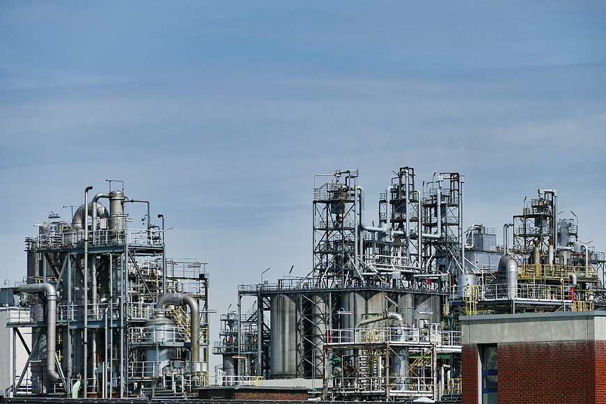 Industrial Oil Refinery Complex With Pipelines And Storage Tanks