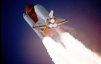 Space Shuttle Launching into Blue Sky with Smoke Trails