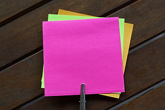 Blank Sticky Notes On Wooden Table With Metal Clip
