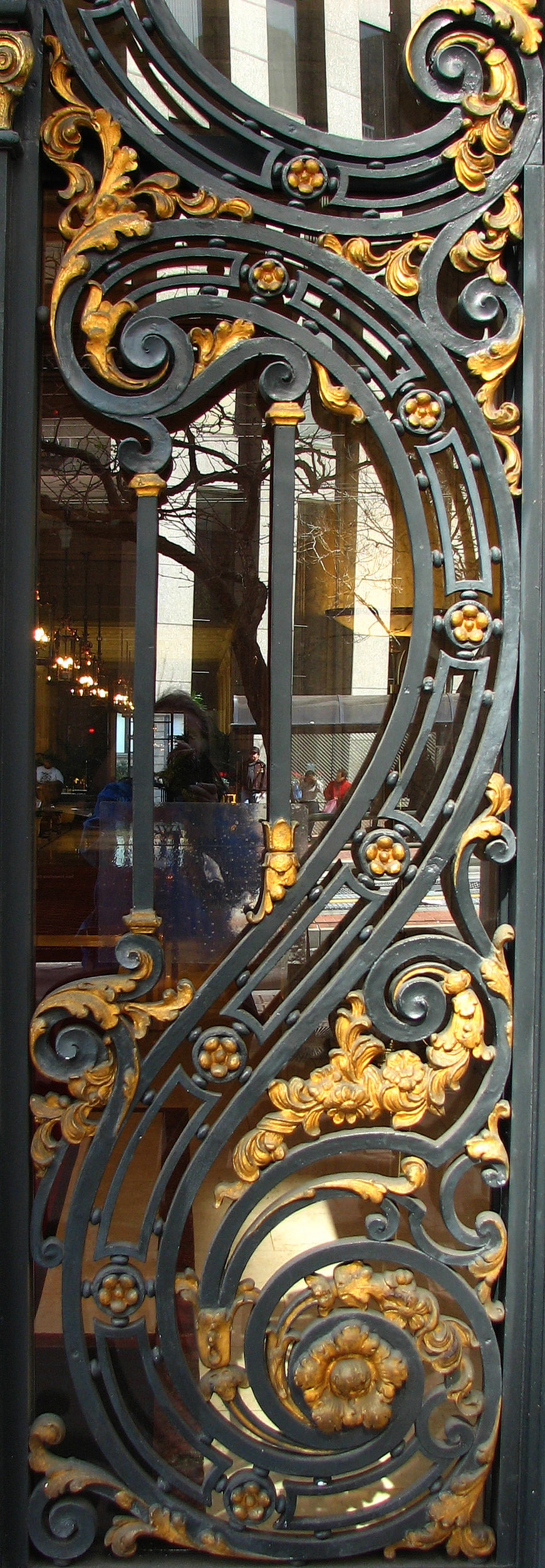 Ornate black and gold wrought iron gate detail