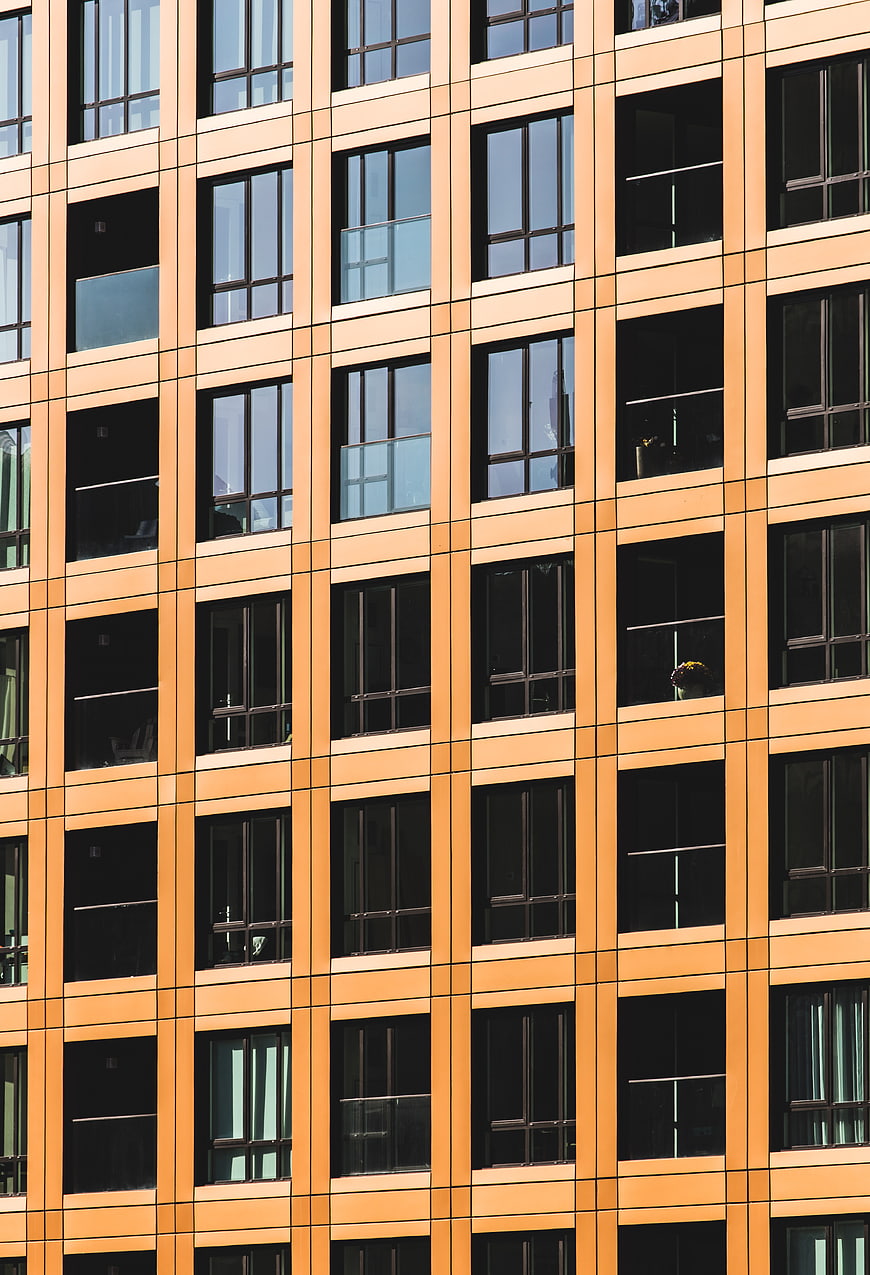 Modern Orange Office Building Facade with Grid Pattern