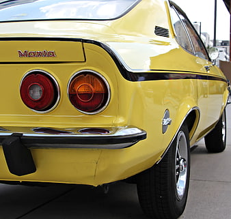 Rear View of Classic Yellow Manta Muscle Car