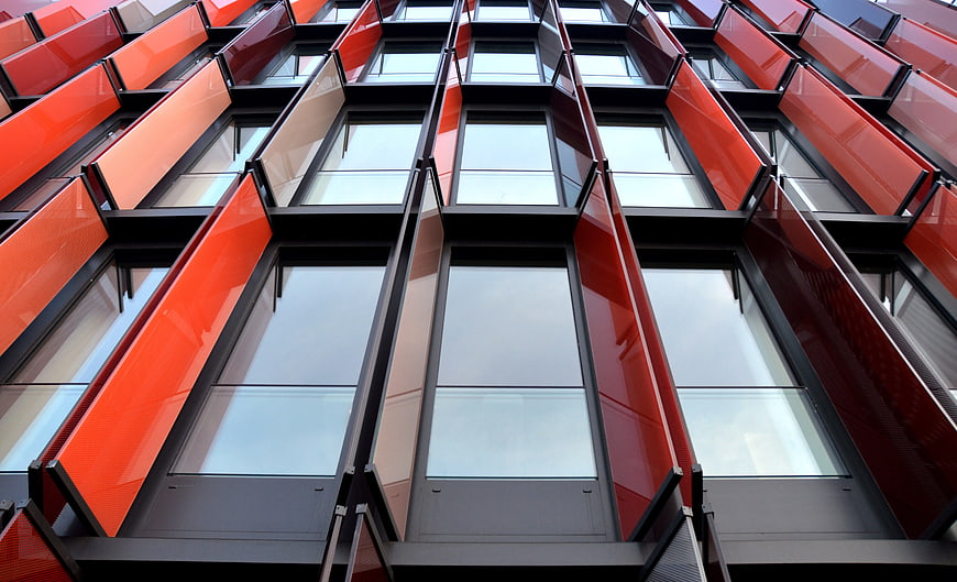 Low Angle View of Modern Red and Black Building Facade