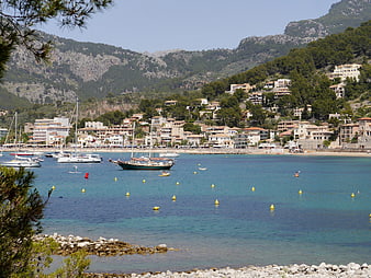 Scenic view of Port de Sóller bay with boats and mountains